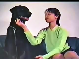 young asian girl loves own big dog